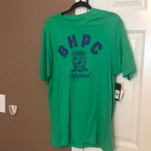 A green and navy blue polo shirt